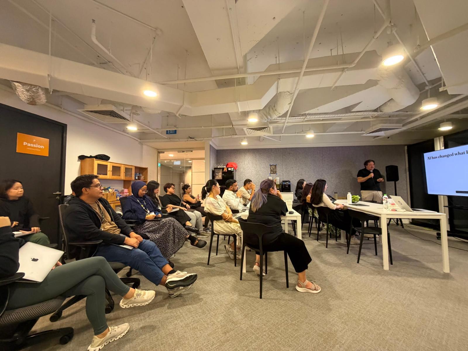 Max Del Vita speaking to professionals at an evening session in Singapore
